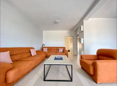a living room with a couch and a table at Sam Villa in Ulcinj