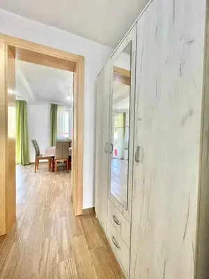 an empty living room with a large mirror on the wall at Talia Apartments in Budva