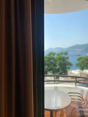 a view from a window of a table and a balcony at DeLux Apartmani in Dobra Voda