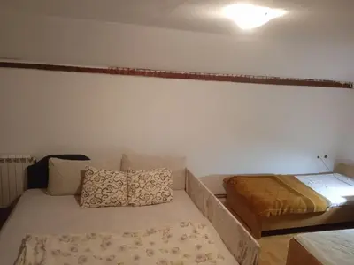 a small room with a bed and a mattress at Vila Natalija in Podgorica