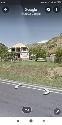 a picture of a road with arrows pointing to a house at Villa Natalija in Podgorica