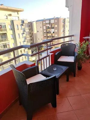 a balcony with two chairs and a table on a balcony at Apartman Filip in Podgorica