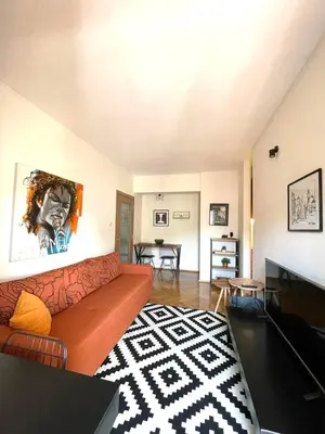 a living room with a couch and a table at Apartman Filip in Podgorica
