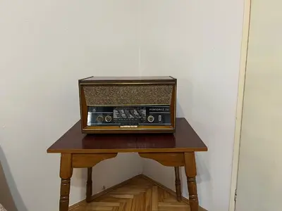 an old radio sitting on a wooden table at Gorica hill apartment in Podgorica