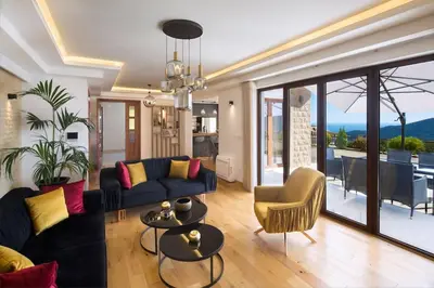 a living room with a couch and a table at Villa Gradina in Budva