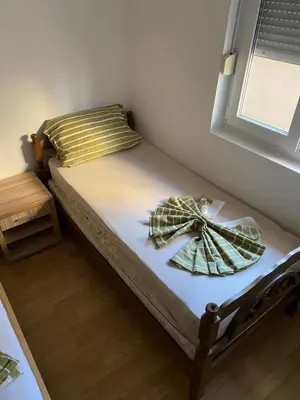 a bedroom with a bed with a bow on it at Sun-Love in Sutomore