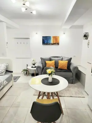 a living room with a couch and a table at Apartment Marina in Kotor