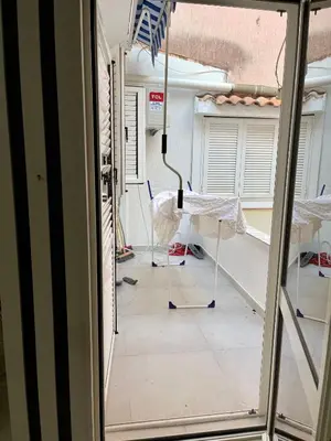 an open door to a room with a table and chairs at Budva house Maja in Budva