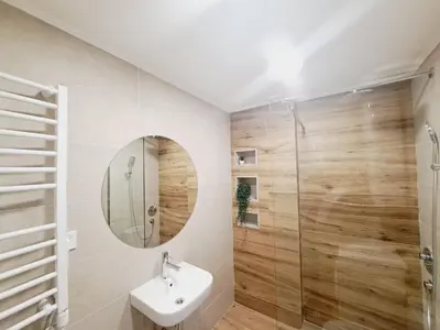 a bathroom with a sink and a mirror at Paun apartment in Kotor
