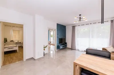 a living room with a couch and a television at Paun apartment in Kotor