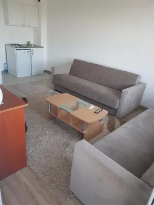 a living room with a couch and a coffee table at Dina & Dona in Ulcinj