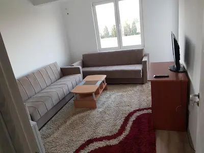 a living room with a couch and a coffee table at Dina & Dona in Ulcinj