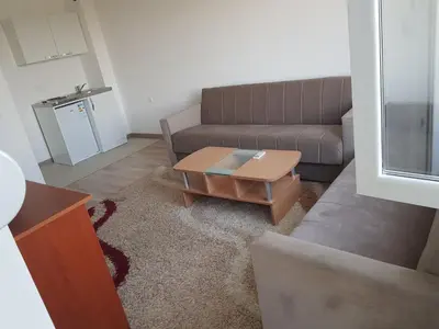 a living room with a couch and a coffee table at Dina & Dona in Ulcinj