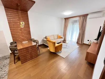 a living room with a couch and a table at Apartments Tulip Podgorica in Podgorica