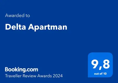 a blue sign with the text emailed to delta apartmentarian at Delta Apartman in Podgorica