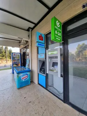 a gas station with a cash register in a store at Riverside Apartment in Podgorica