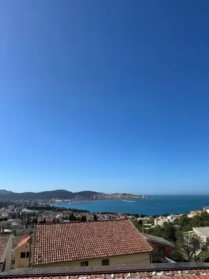 a view of the ocean from a city at Apartmani Green Olive in Bar, Susanj