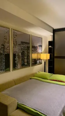 a bedroom with a bed and a couch and windows at Villa Green Olive Bar in Bar, Susanj