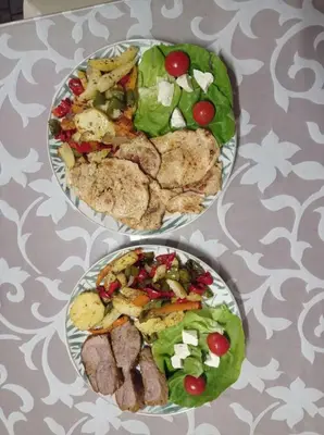 two plates of food on top of a table at Old wine in Virpazar