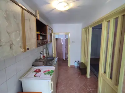 a kitchen with a sink and a stove in it at Apartman Sole in Sutomore