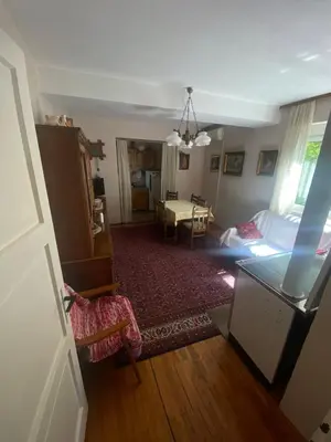 a living room with a bed and a table at Apartman Elena in Ulcinj