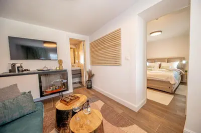 a living room with a couch and a bed at N&N Lux Guest house in Bar