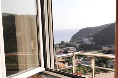 a view of the ocean from a window at Mahakala Center in Petrovac na Moru