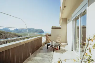 a balcony with a view of the ocean at Mahakala Center in Petrovac na Moru