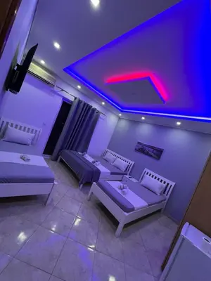 a room with two couches and a red light at Keno & Keon in Ulcinj