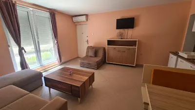 a living room with a couch and a table at Apartments Bulatović in Bar
