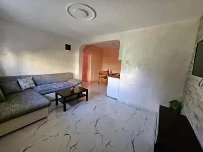 a living room with a couch and a table at Apartments Bulatović in Bar