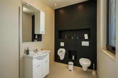 a bathroom with a sink and a toilet at Villa Harizma in Budva
