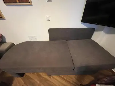 a brown coffee table in a room with a tv at El Sol Apartmani in Bar