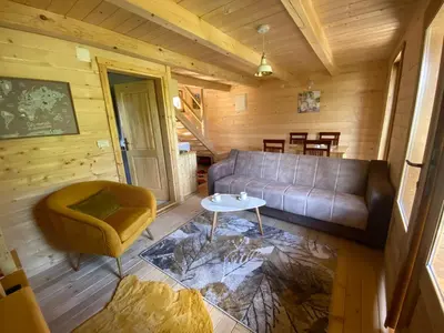 a living room with a couch and a table at Peaceful Oasis in Ulcinj
