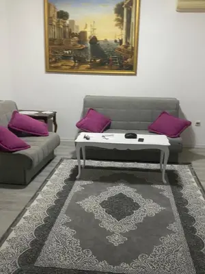 a living room with a couch and a coffee table at Apartman Lara in Sveti Stefan