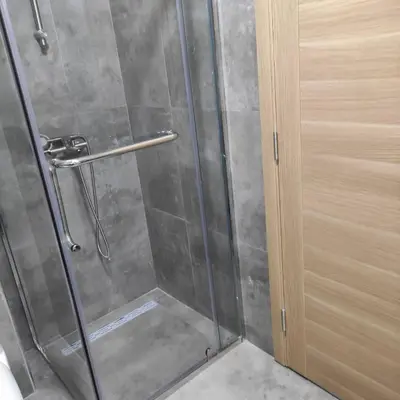 a shower with a glass door in a bathroom at Podgorica apartman in Podgorica