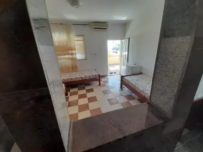 a view of a room with two benches and a mirror at Apartmani Ličina in Becici