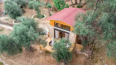 an overhead view of a small house with a red roof at Olive Treasure in Ulcinj