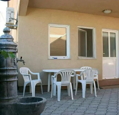 a white table and chairs on a patio at Bojana Blue Retreat in Ulcinj