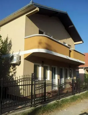 a house with a fence in front of it at Bojana Blue Retreat in Ulcinj