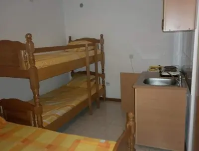 a kitchen with two bunk beds and a sink at Bojana Blue Retreat in Ulcinj