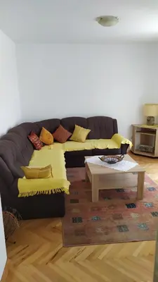 a living room with a couch and a coffee table at FLAT FOR RENT MARINOVIC in Budva