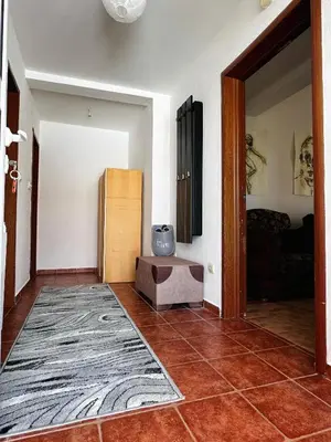 a living room with a room with a door open at House of peace in Podgorica