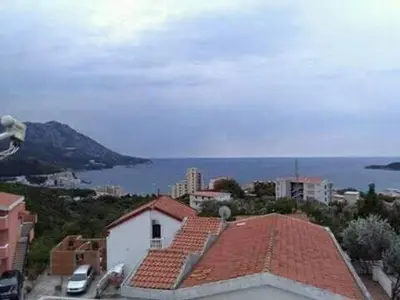 a view of a city with the ocean and buildings at Daco22 in Becici