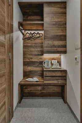 a kitchen with wood paneled walls and a counter at Hotel Vladimir in Budva
