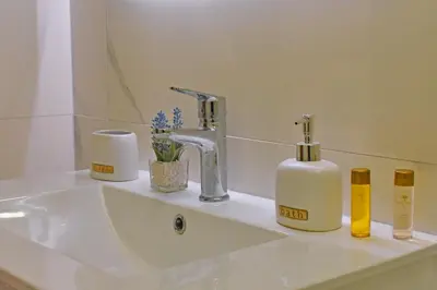 a bathroom sink with two soap bottles on it at Apartments Amar in Ulcinj