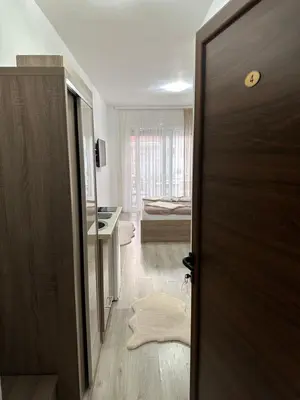 a door leading to a room with a bedroom at Apartments Amar in Ulcinj
