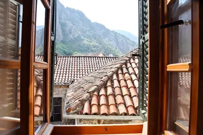 a view from a window of a roof at Cozy 2 Bedroom Apartment in Antique Bizanti Palace in Kotor