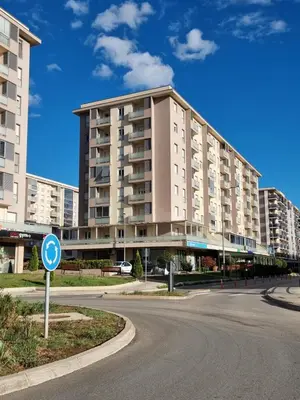 a large apartment building on the side of a street at Adrianna apartment City kvart in Podgorica
