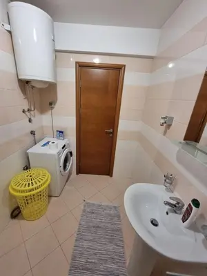 a bathroom with a sink and a toilet at 5 star apartment in Podgorica